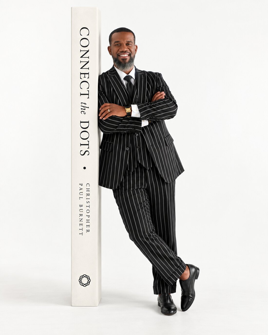Christopher Paul Burnett standing beside the spine of Connect the Dots